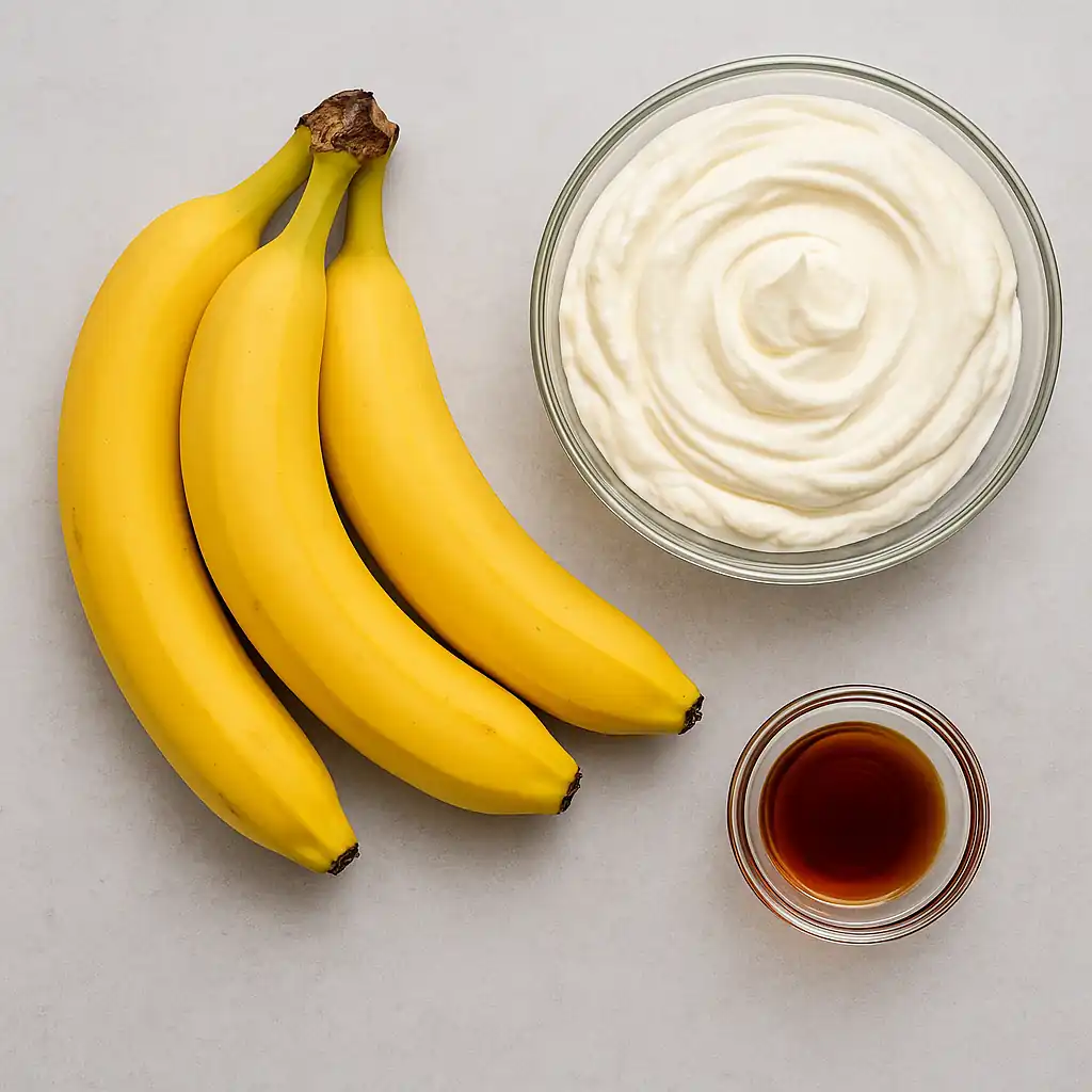 Fresh bananas, whipped cream, and vanilla extract ingredients for banana cream dessert